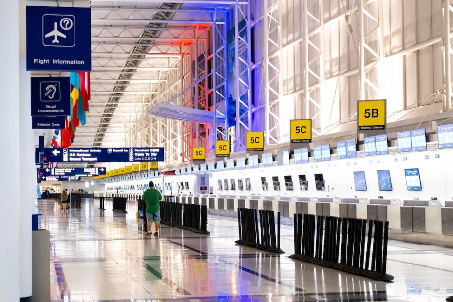 A person walking to a check in desk